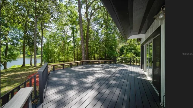 a view of outdoor space with deck and yard