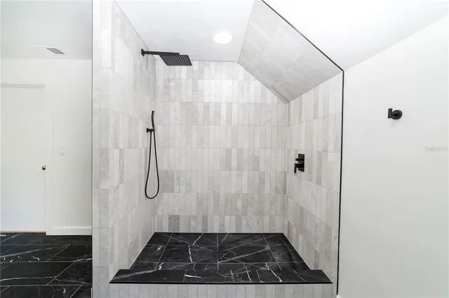 an empty room with a closet and wooden floor