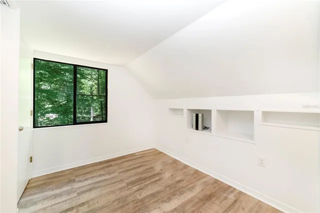 a view of living room that has a fireplace