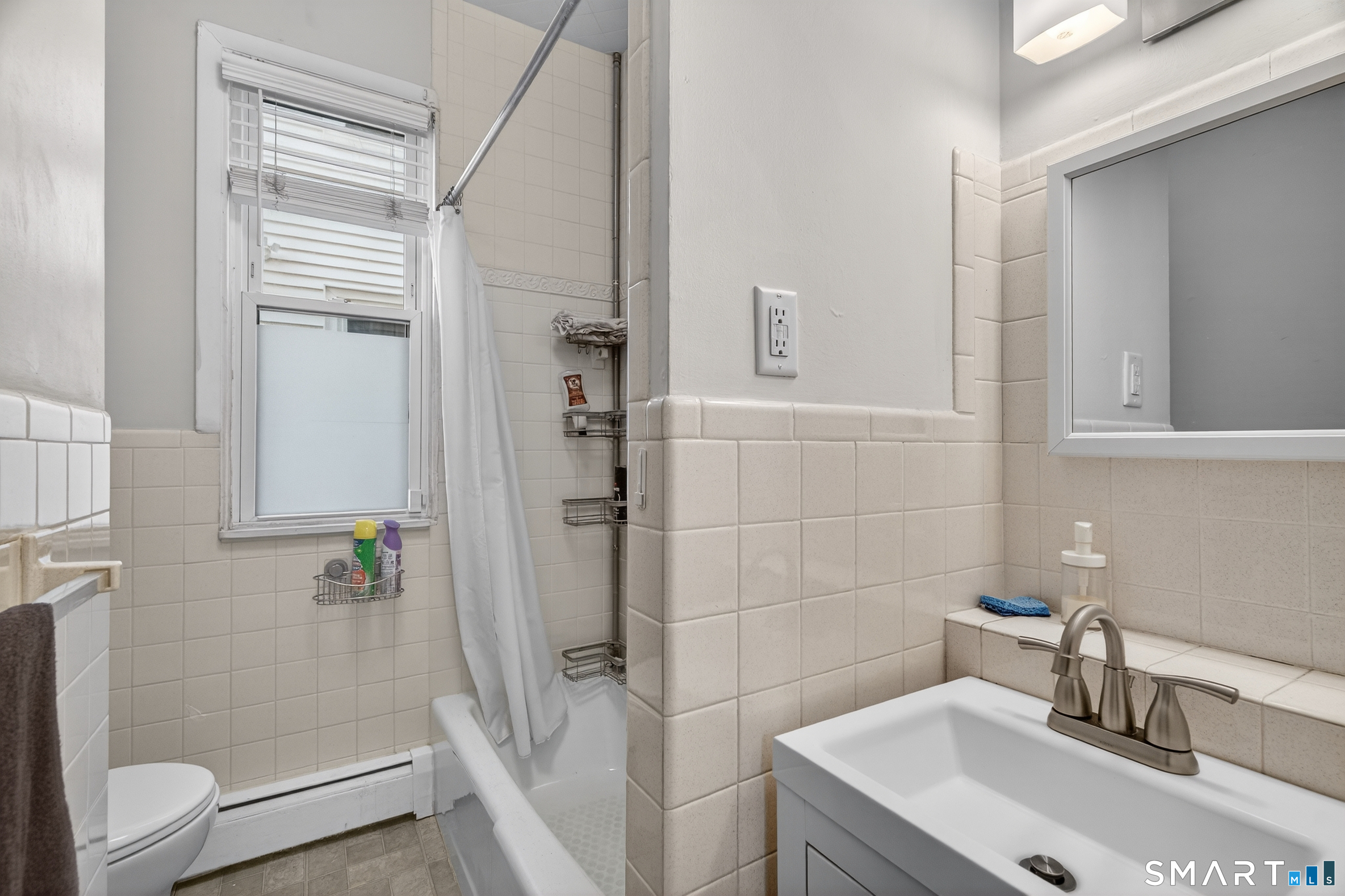 832 State Street New Haven, CT 06511 - Photo 18 of 39 a bathroom with a sink a toilet and shower