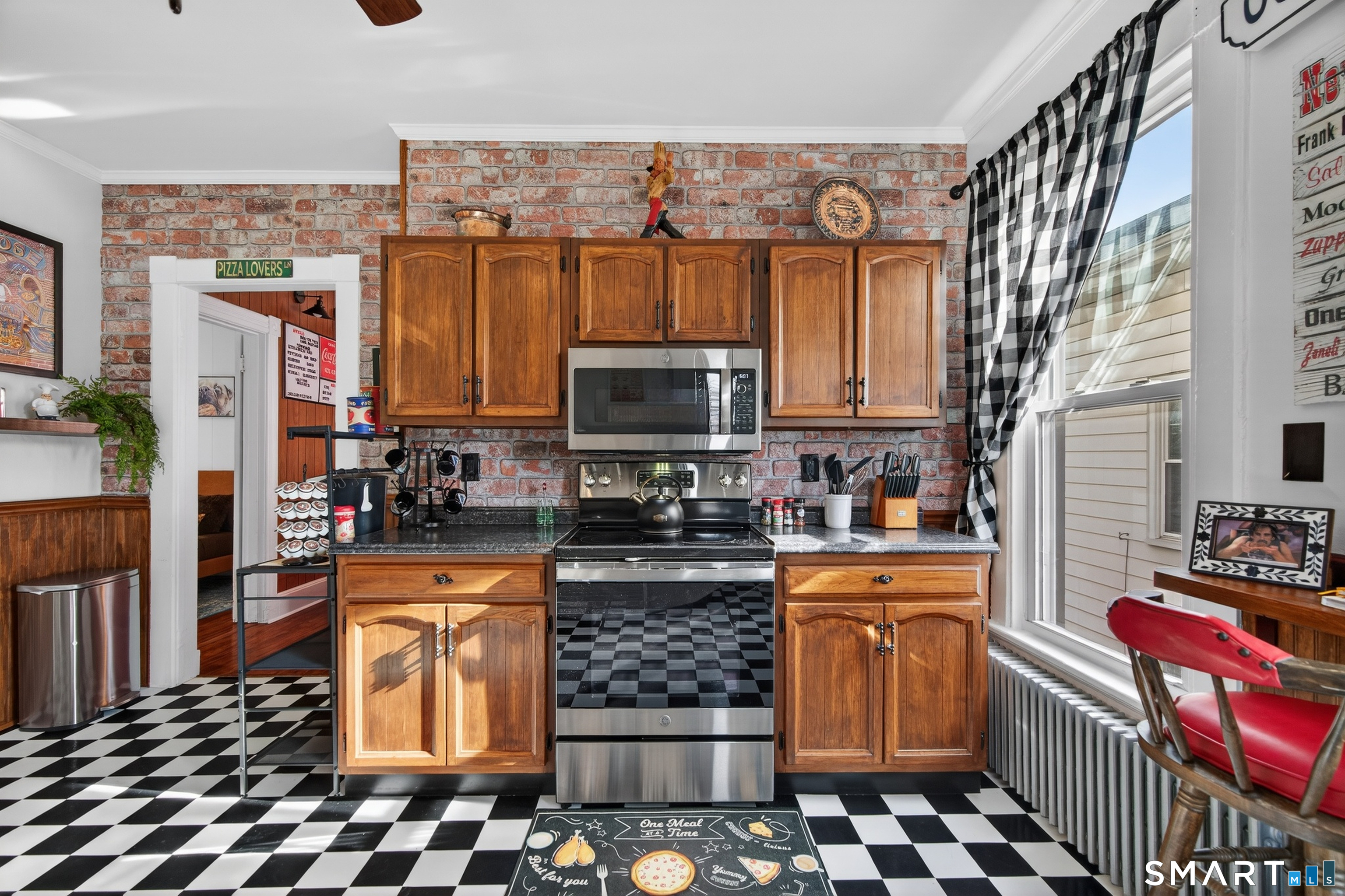 832 State Street New Haven, CT 06511 - Photo 24 of 39 a kitchen with stainless steel appliances granite countertop a stove a sink and a microwave