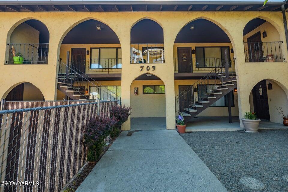 703 South 38th Avenue, Unit 8 Yakima, WA 98902 - Photo 1 of 10 a front view of a house with a garden