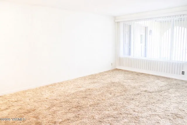 an empty room with natural light