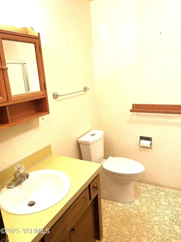 a bathroom with a shower and a toilet