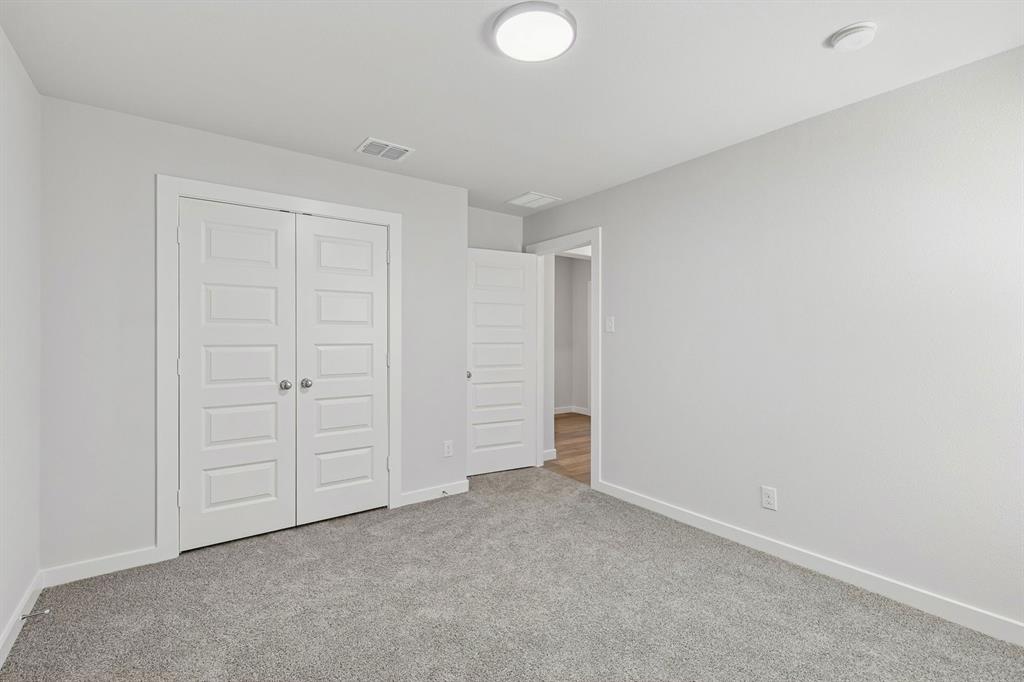 769 Sierra Ridge Lavon, TX 75166 - Photo 29 of 37 Bedroom in the Harrison home plan by Trophy Signature Homes – REPRESENTATIVE PHOTO