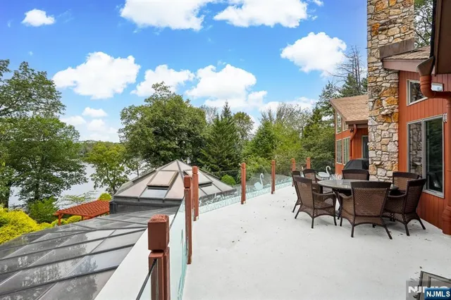 a view of a patio with iron fence