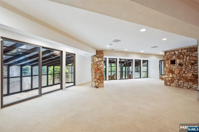 a view of an empty room with a balcony