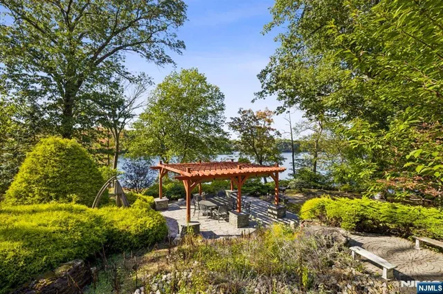a backyard of a house with table and chairs