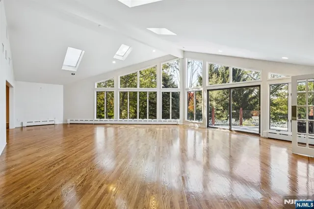 a view of an entryway with wooden floor