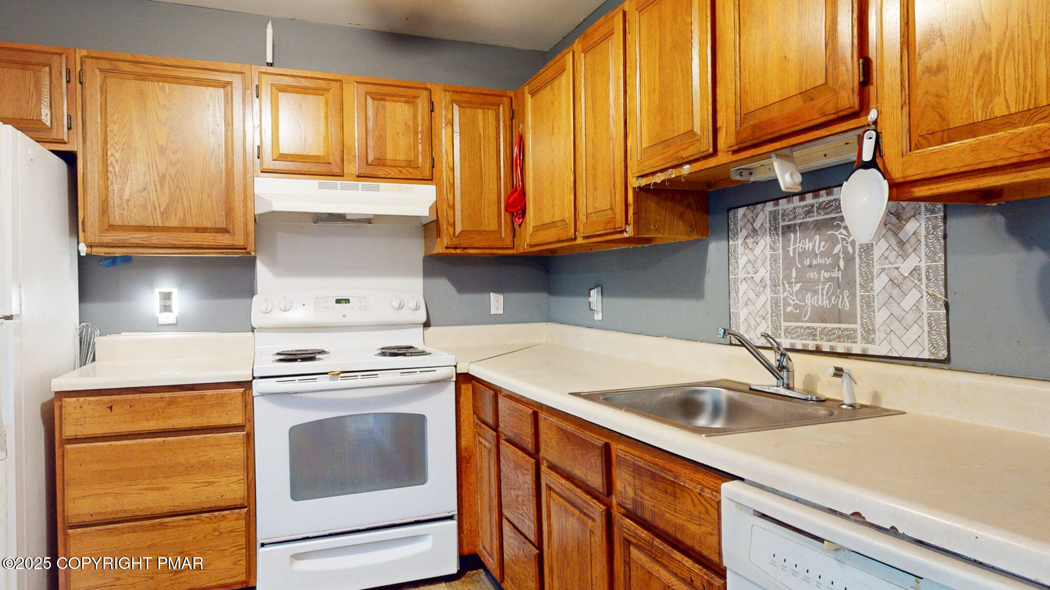 619 Rimrock Road Bartonsville, PA 18321 - Photo 12 of 65 a kitchen with a sink stove and cabinets