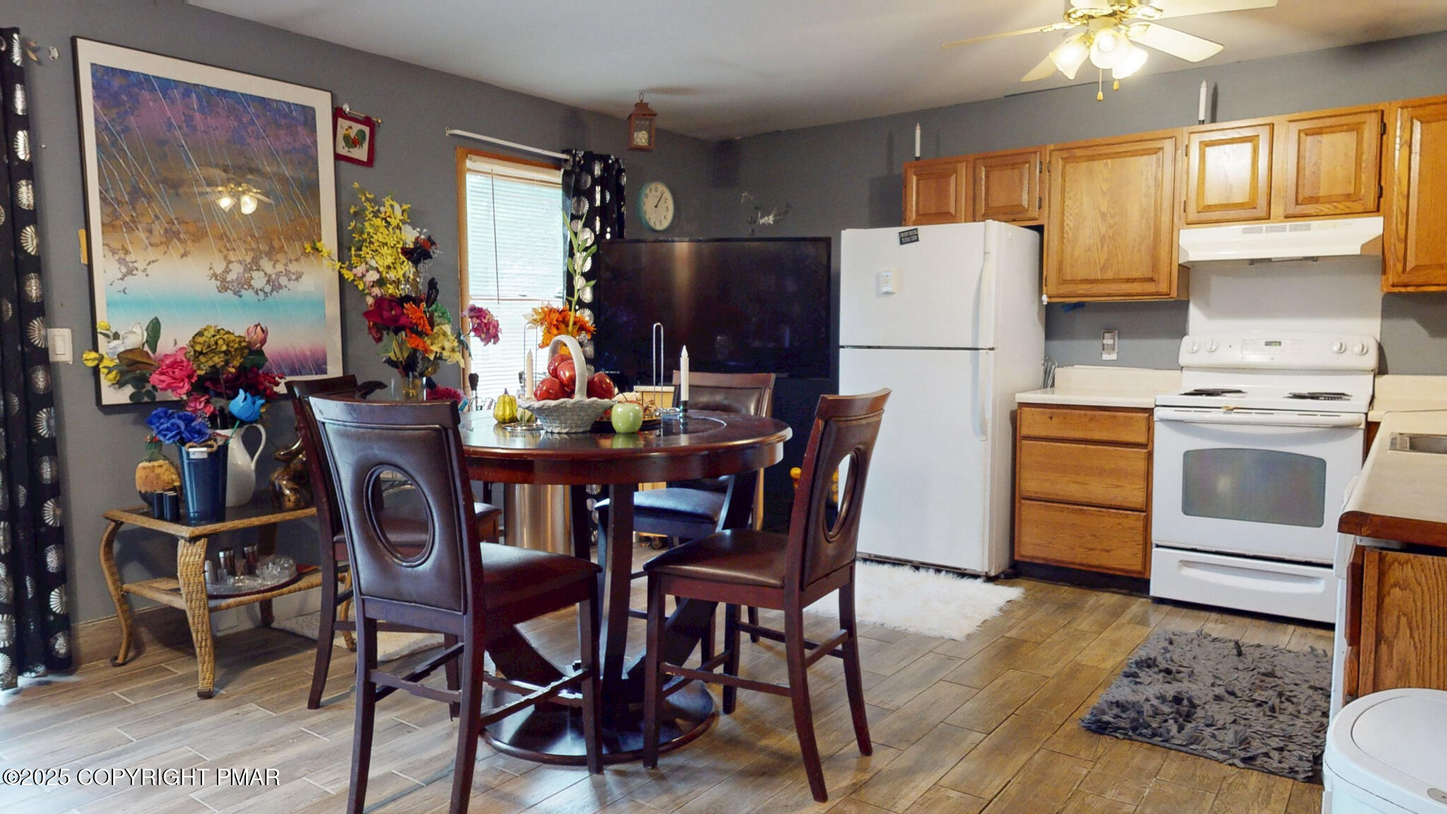 619 Rimrock Road Bartonsville, PA 18321 - Photo 14 of 65 a kitchen with stainless steel appliances a stove a refrigerator a dining table and chairs