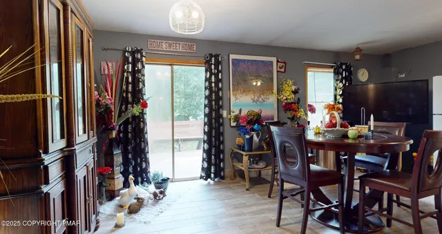 a view of an empty room with a fireplace and a window