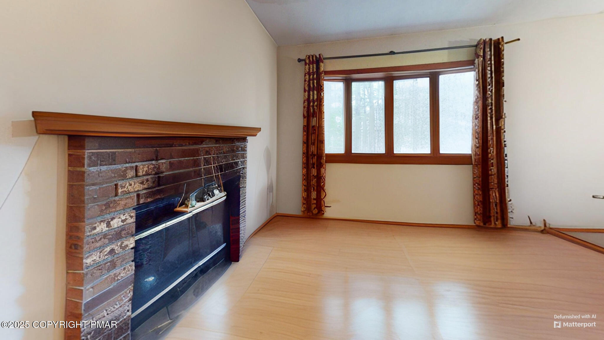 619 Rimrock Road Bartonsville, PA 18321 - Photo 21 of 65 a view of an empty room with a fireplace and a window