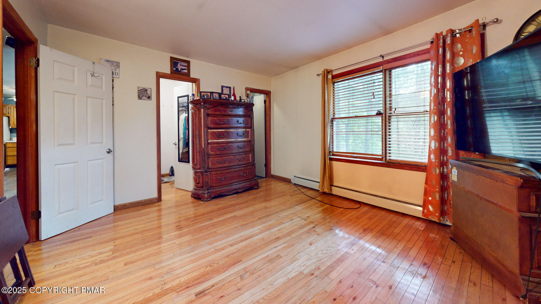619 Rimrock Road Bartonsville, PA 18321 - Photo 35 of 65 a view of an empty room with a window and wooden floor