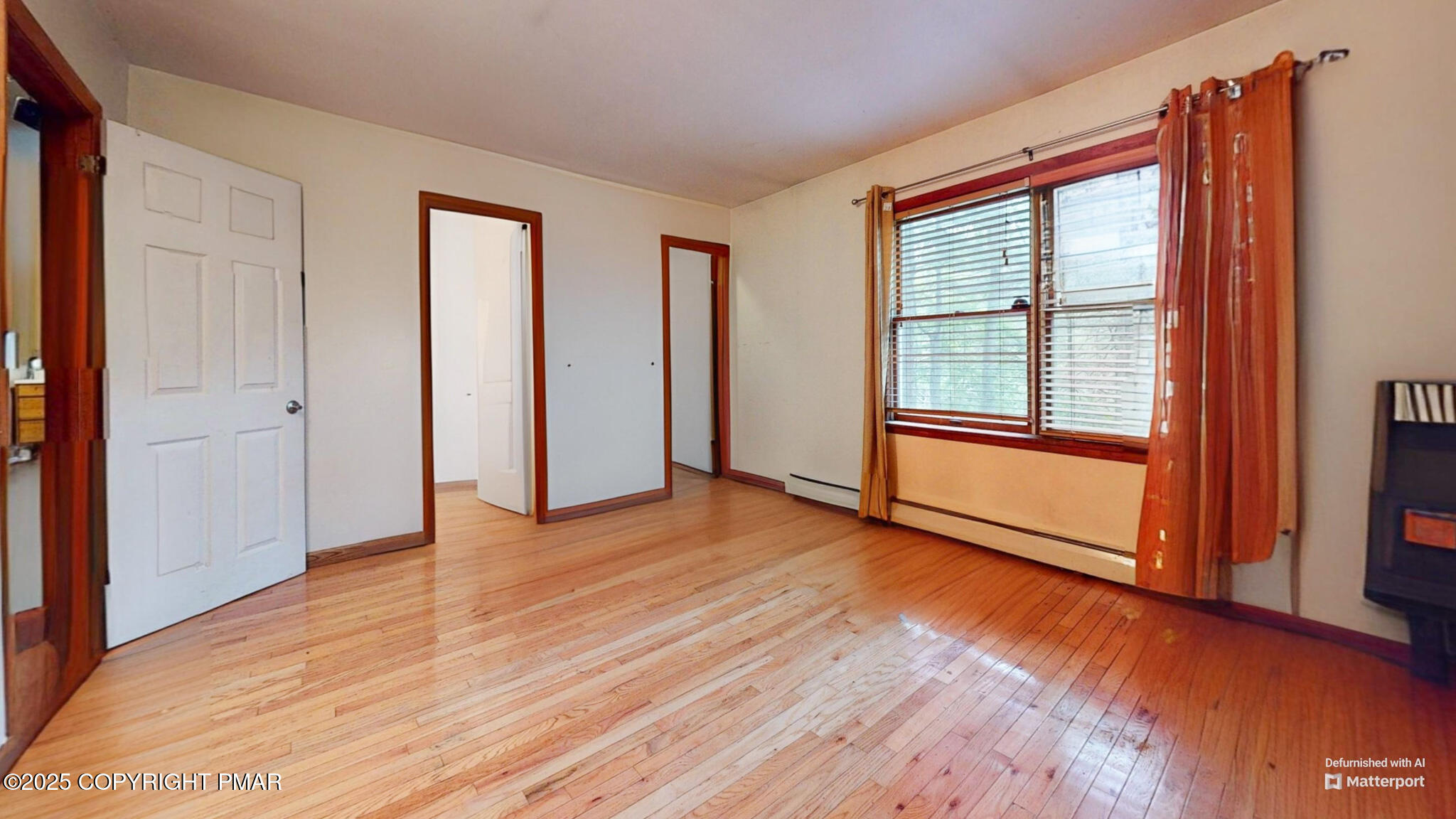 619 Rimrock Road Bartonsville, PA 18321 - Photo 36 of 65 a view of an empty room with glass door and wooden floor
