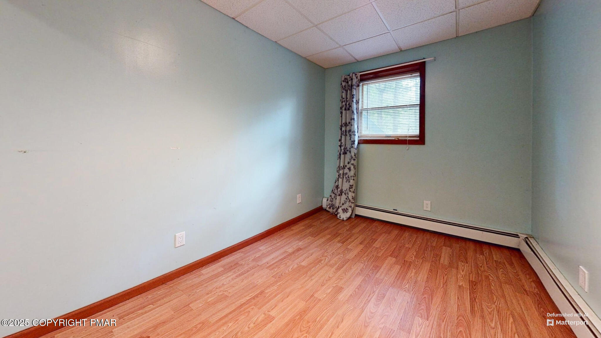 619 Rimrock Road Bartonsville, PA 18321 - Photo 47 of 65 an empty room with wooden floor and windows