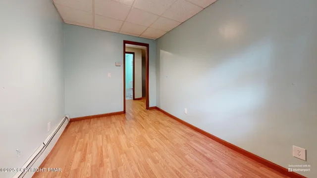 an aerial view of a house with a yard and a fountain
