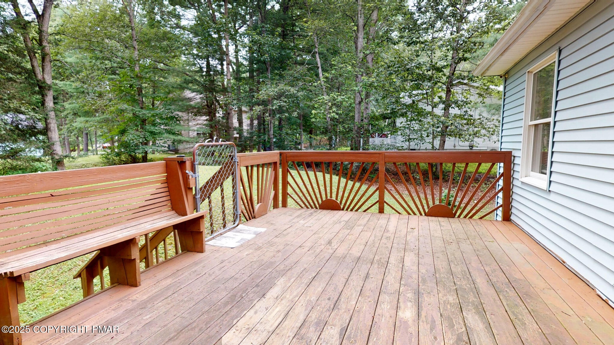 619 Rimrock Road Bartonsville, PA 18321 - Photo 57 of 65 a balcony with wooden floor and trees