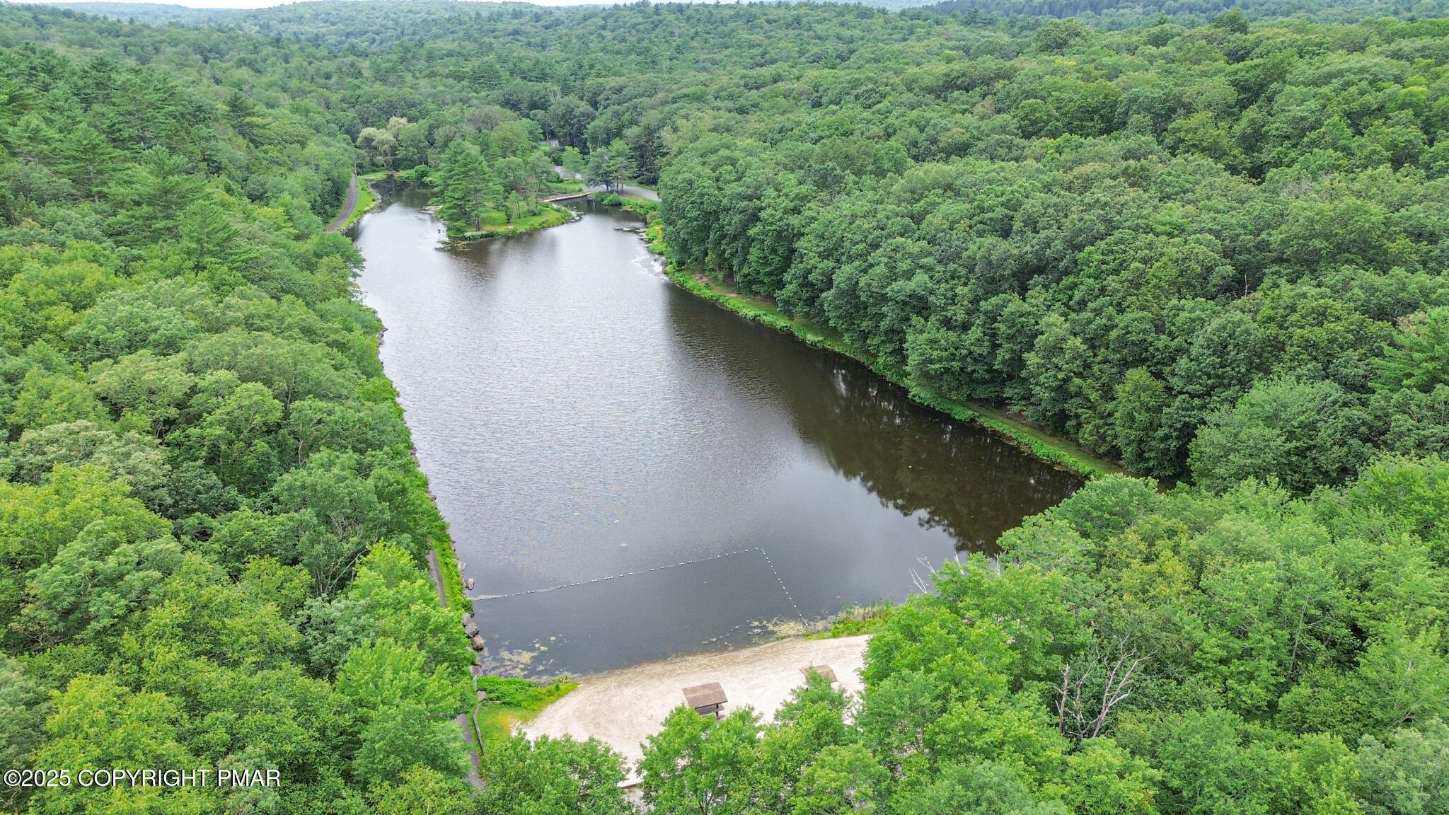 619 Rimrock Road Bartonsville, PA 18321 - Photo 59 of 65 a view of a lake with a yard and mountain view in back
