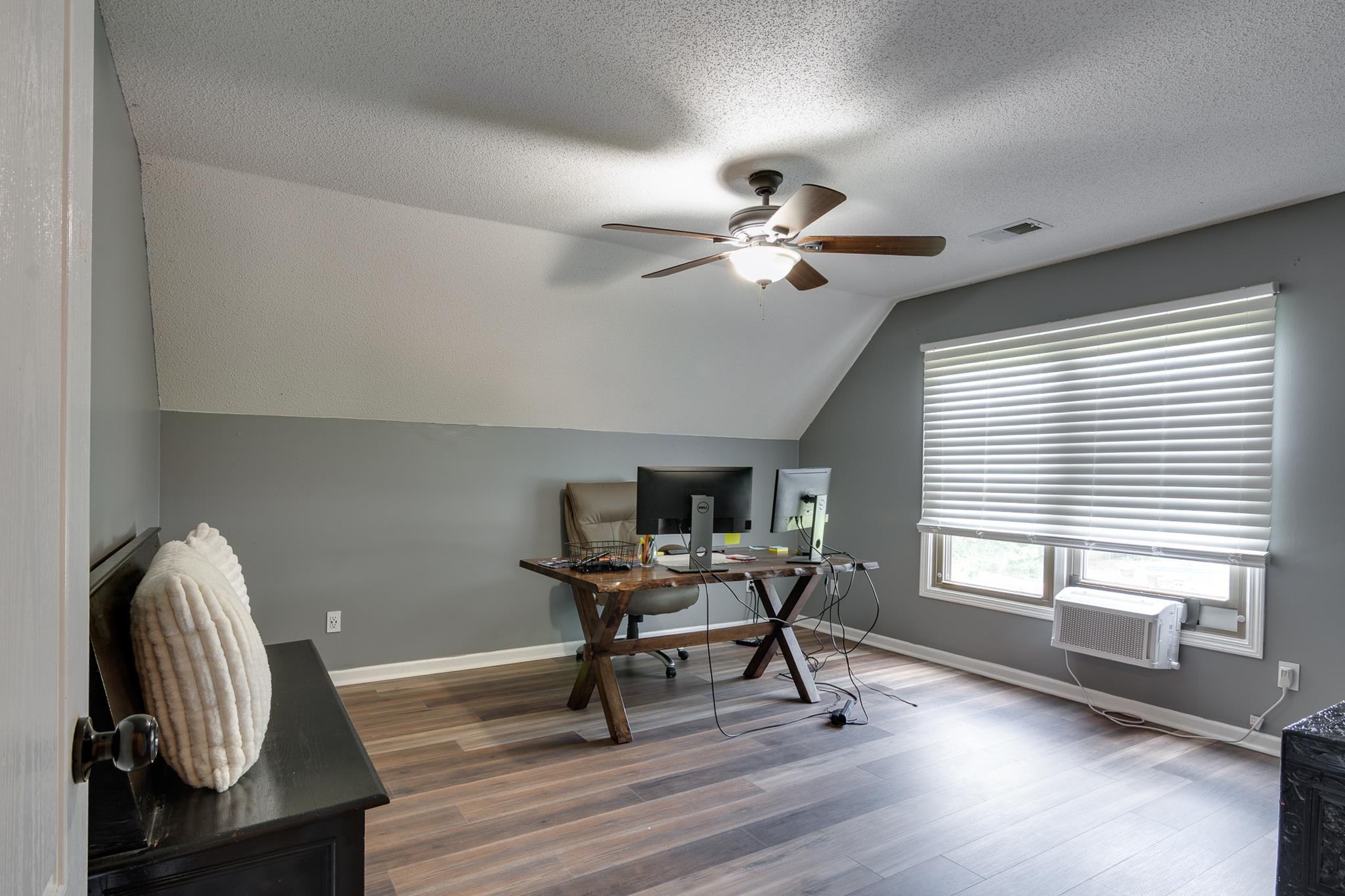 779 Early Earner Cove Collierville, TN 38017 - Photo 17 of 29 Attic room featuring sloped ceilings, wood-finish flooring, and a ceiling fan with integrated lighting