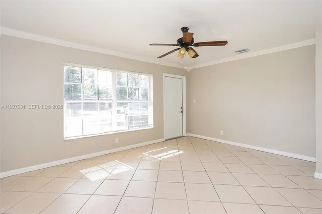 a view of an empty room with a window