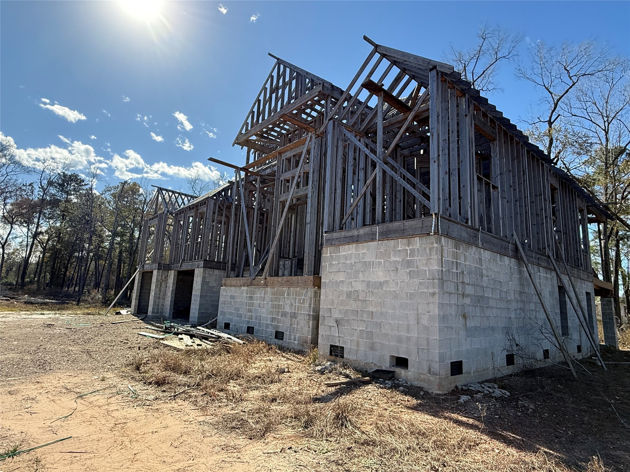 10181 Ehlers Road Conroe, TX 77302 - Photo 2 of 9 a view of a wooden house with a snow in the background