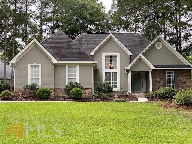 104 Jasmine Way Bonaire, GA 31005 - Photo 1 of 1 a front view of house with yard and green space
