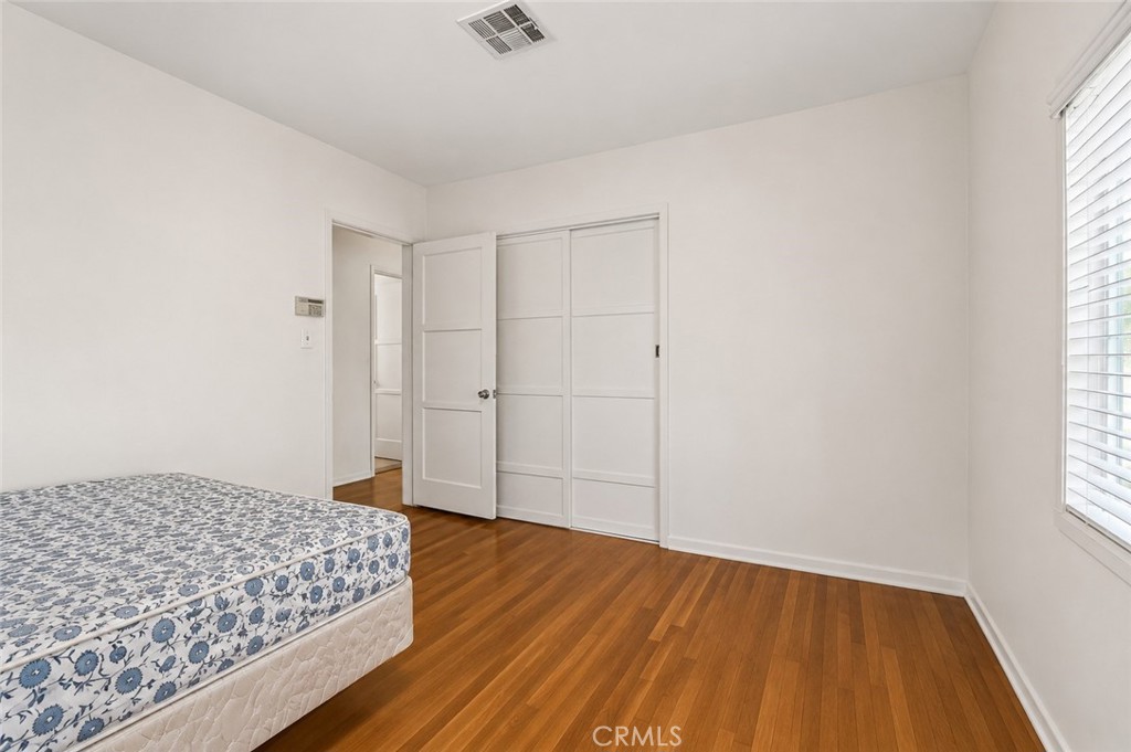 2209 Queensberry Road Pasadena, CA 91104 - Photo 20 of 44 an empty room with wooden floor and windows