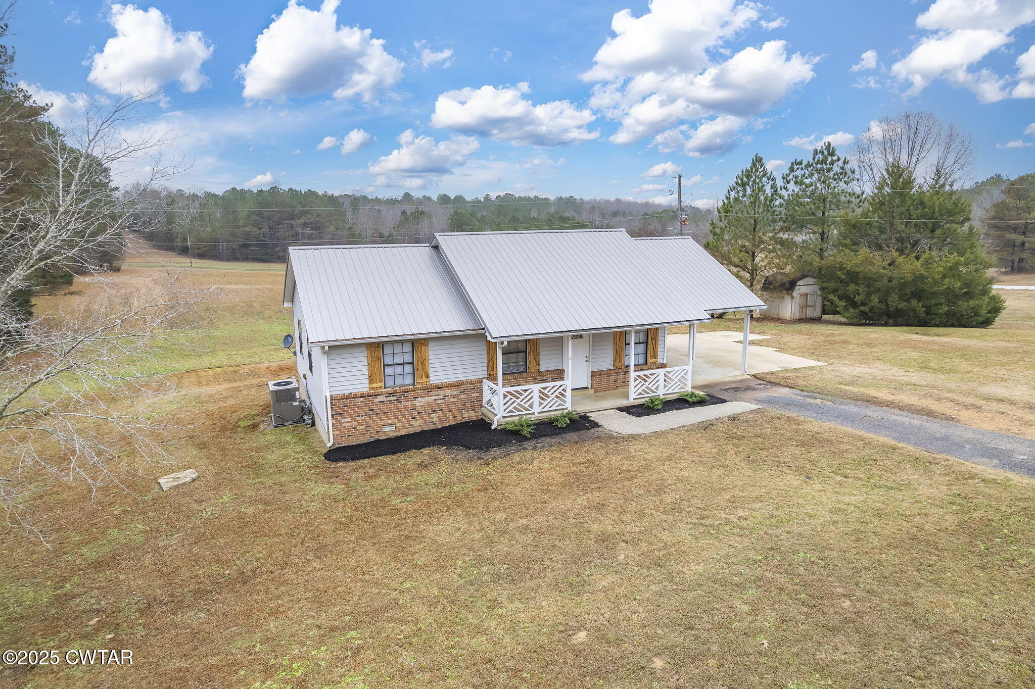 21 Carol Road Huron, TN 38345 - Photo 23 of 29 a view of a house with a yard and sitting area