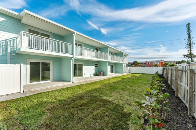 a view of a house with a small yard