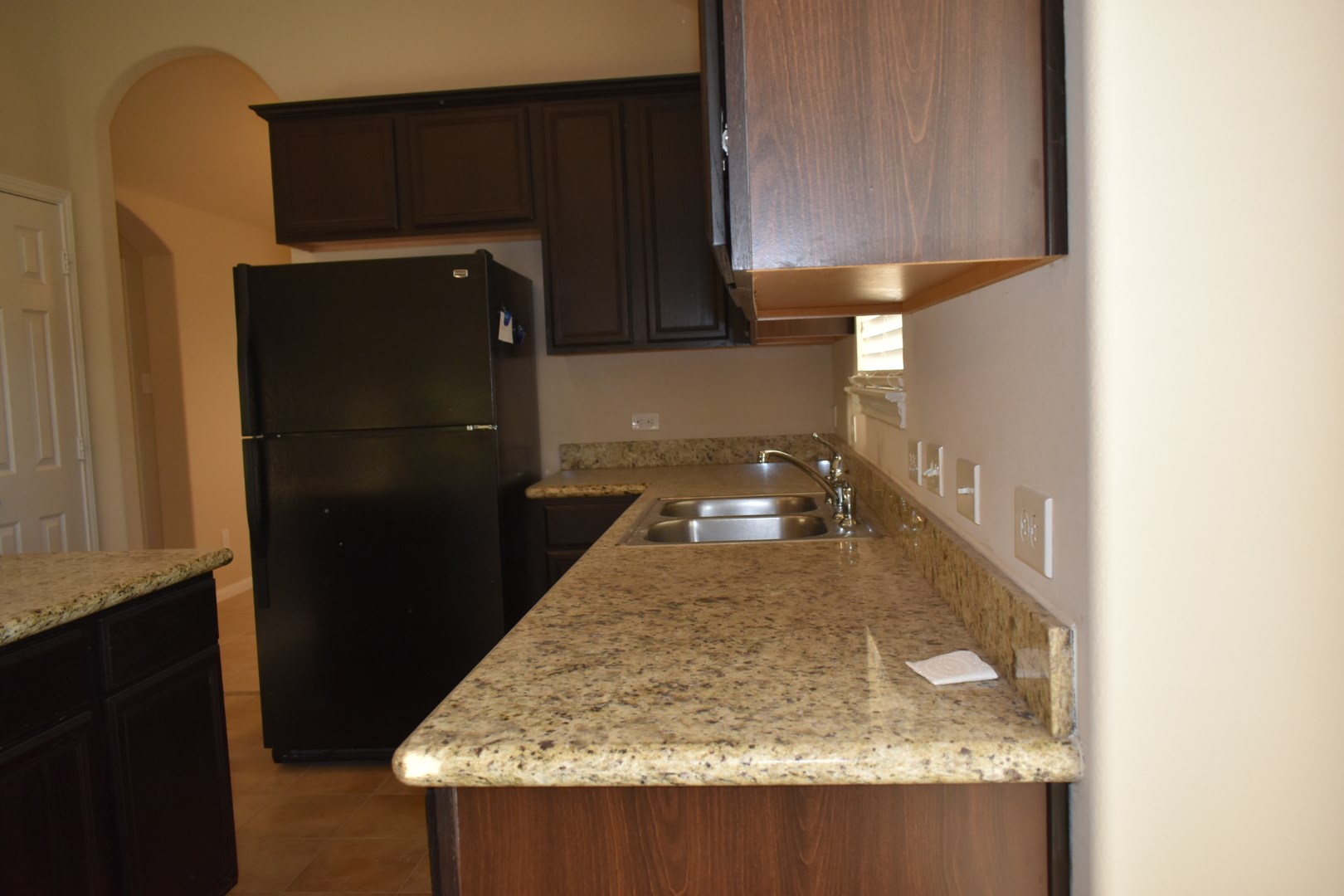 3526 Lily Ranch Drive Katy, TX 77494 - Photo 8 of 23 Granite counter tops and black appliances.