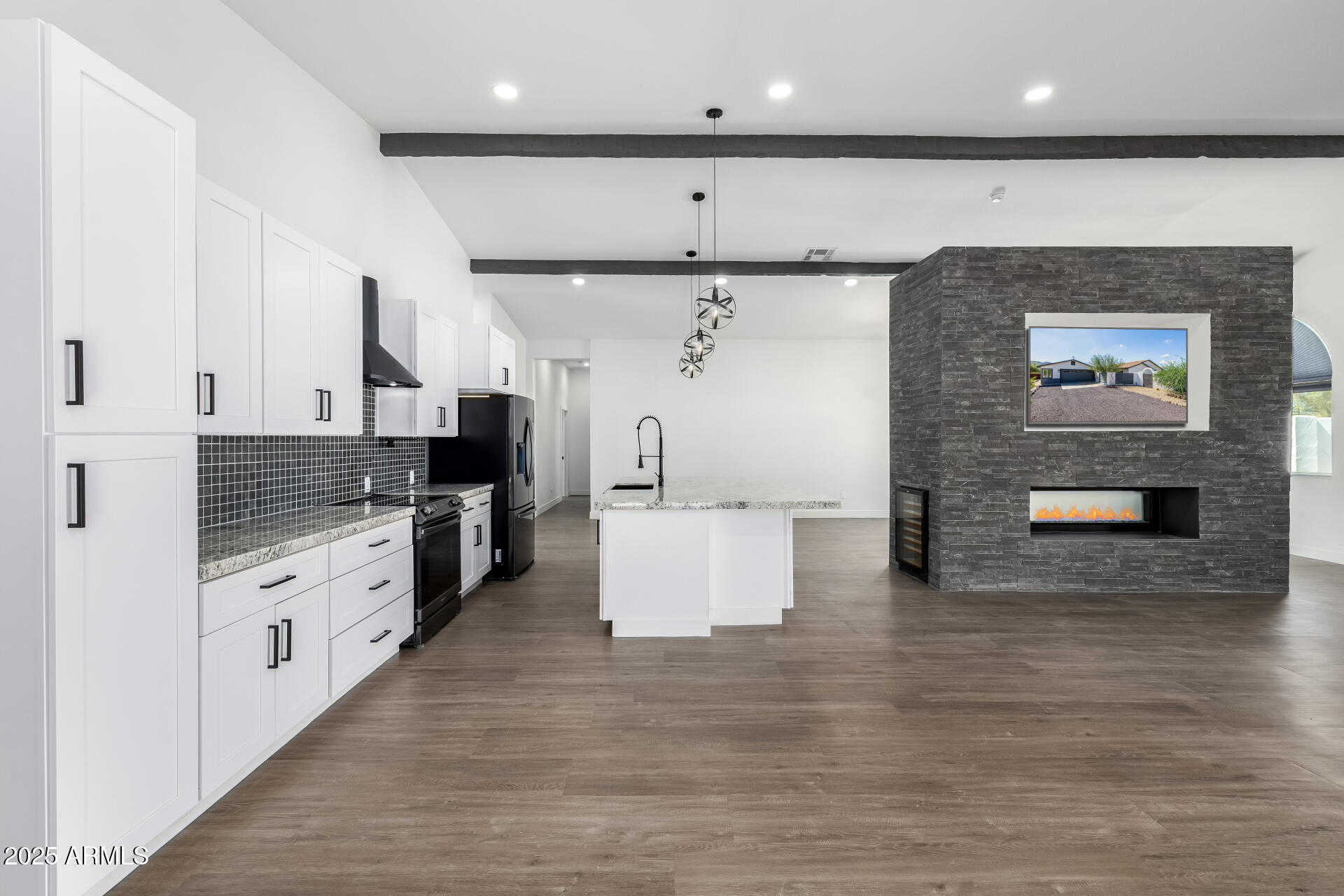 1807 West Joy Ranch Road Phoenix, AZ 85086 - Photo 14 of 49 a large white kitchen with stainless steel appliances kitchen island granite countertop a stove and a refrigerator