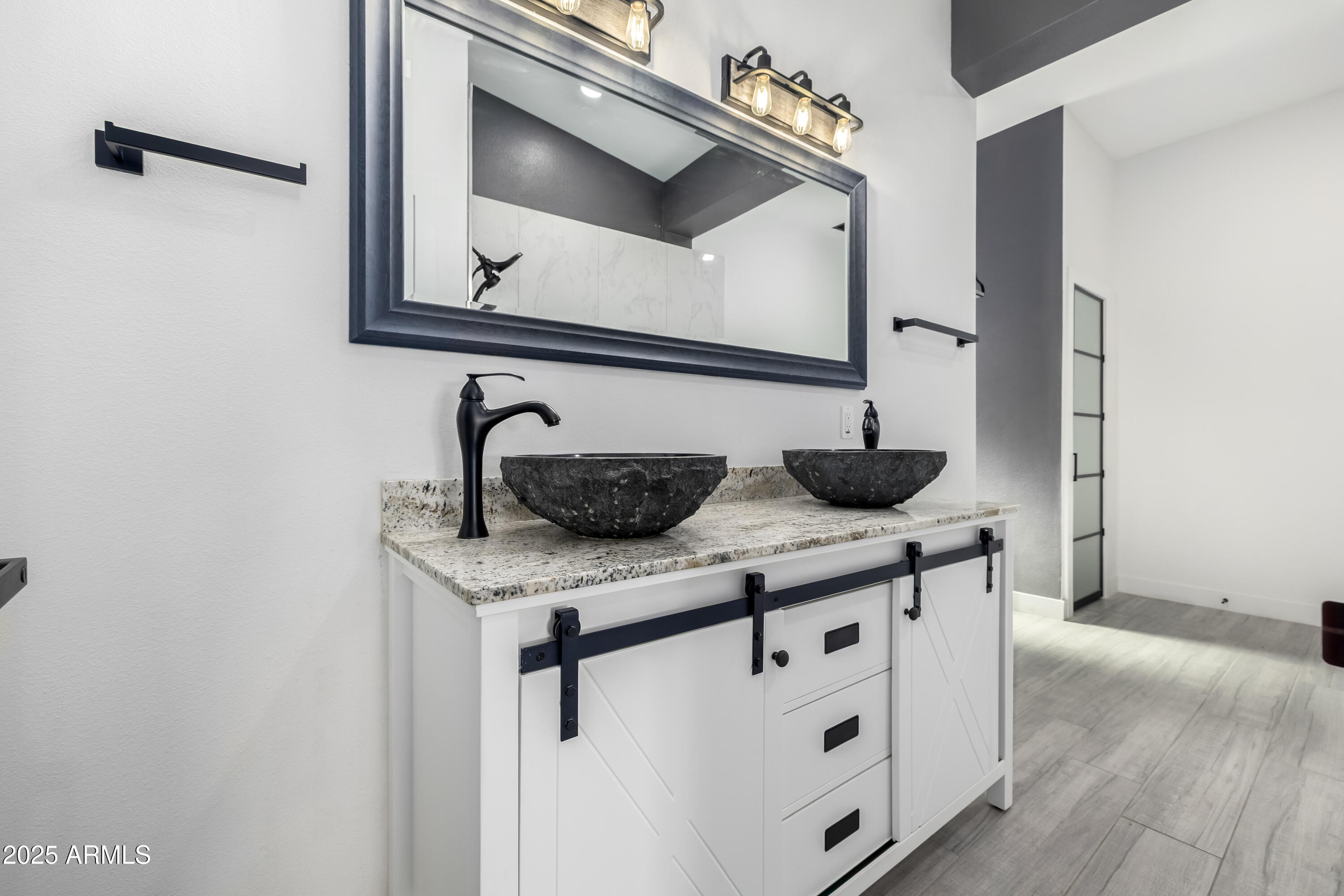 1807 West Joy Ranch Road Phoenix, AZ 85086 - Photo 23 of 49 a bathroom with a sink and a mirror