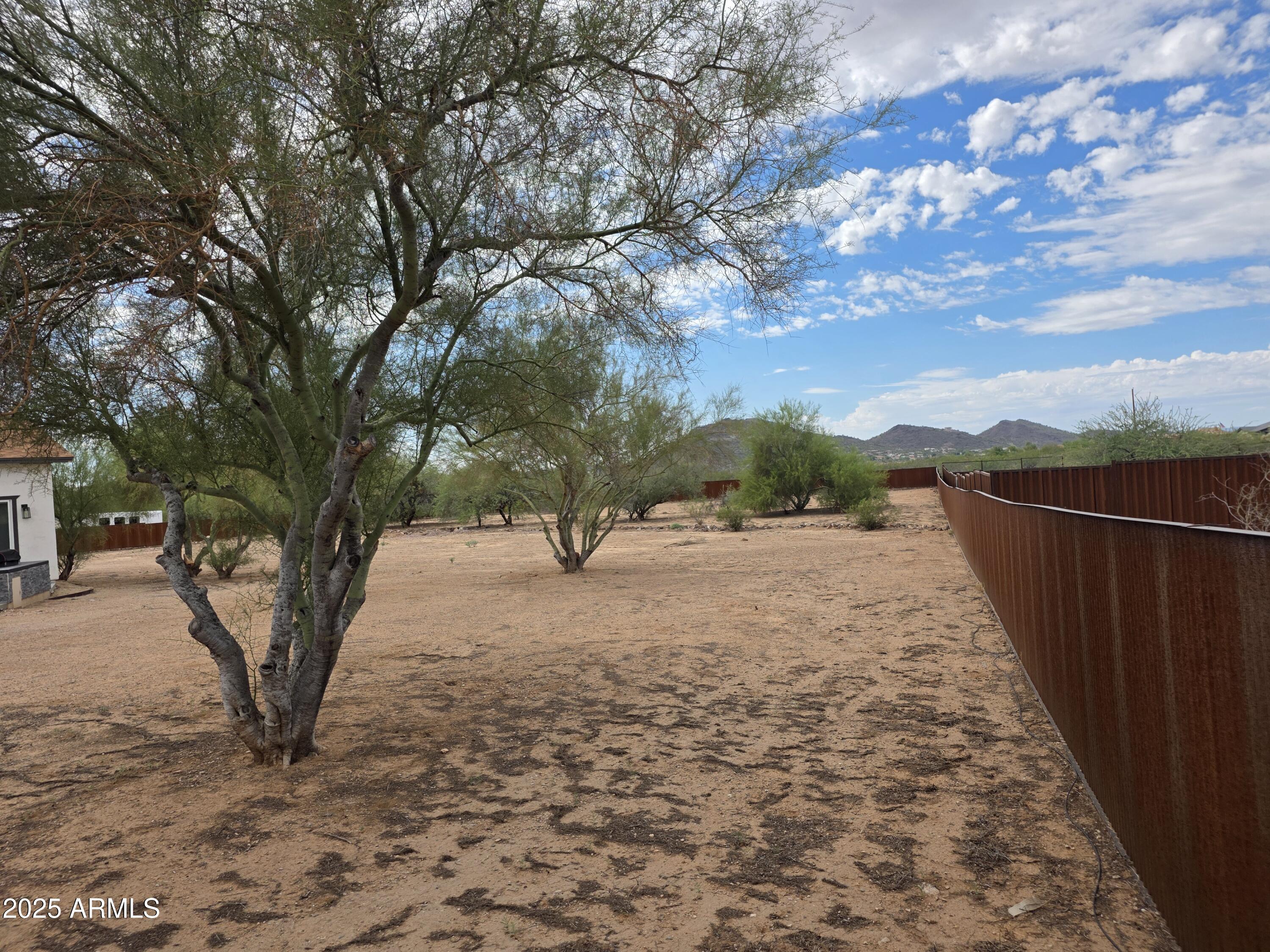 1807 West Joy Ranch Road Phoenix, AZ 85086 - Photo 31 of 49 a view of a backyard of the house