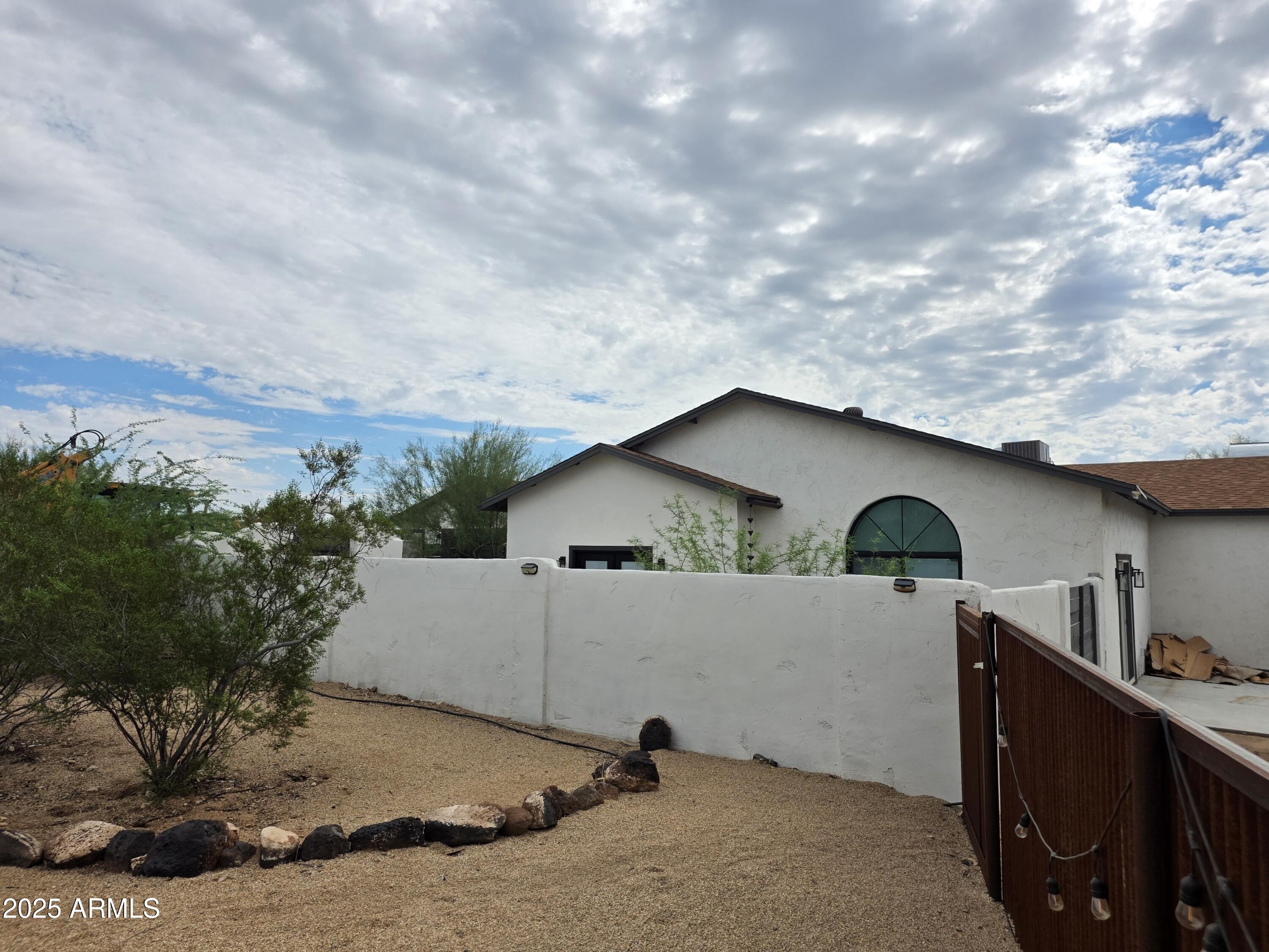 1807 West Joy Ranch Road Phoenix, AZ 85086 - Photo 38 of 49 a view of a house with a yard