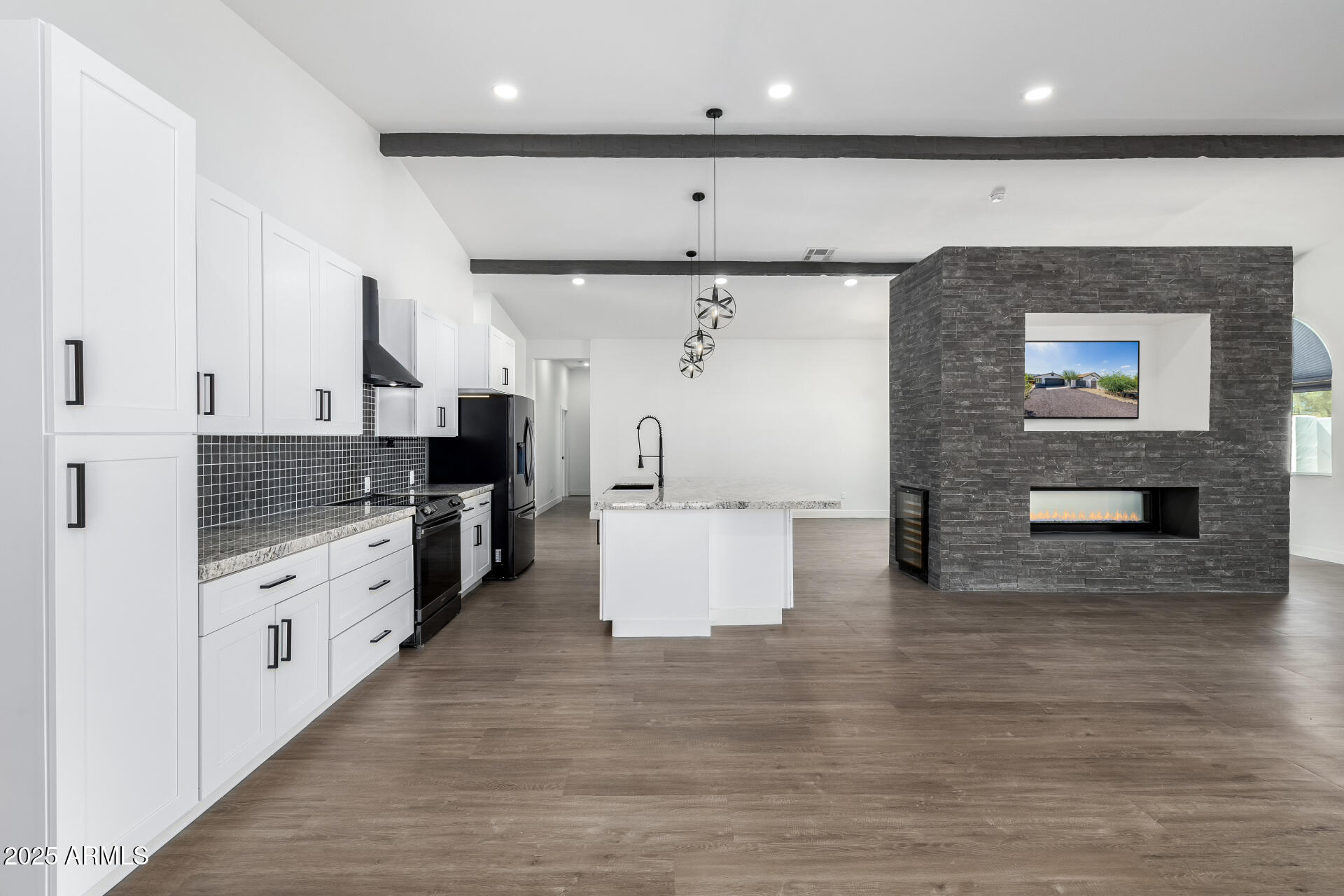 1807 West Joy Ranch Road Phoenix, AZ 85086 - Photo 4 of 49 a large kitchen with stainless steel appliances kitchen island granite countertop a stove and a refrigerator