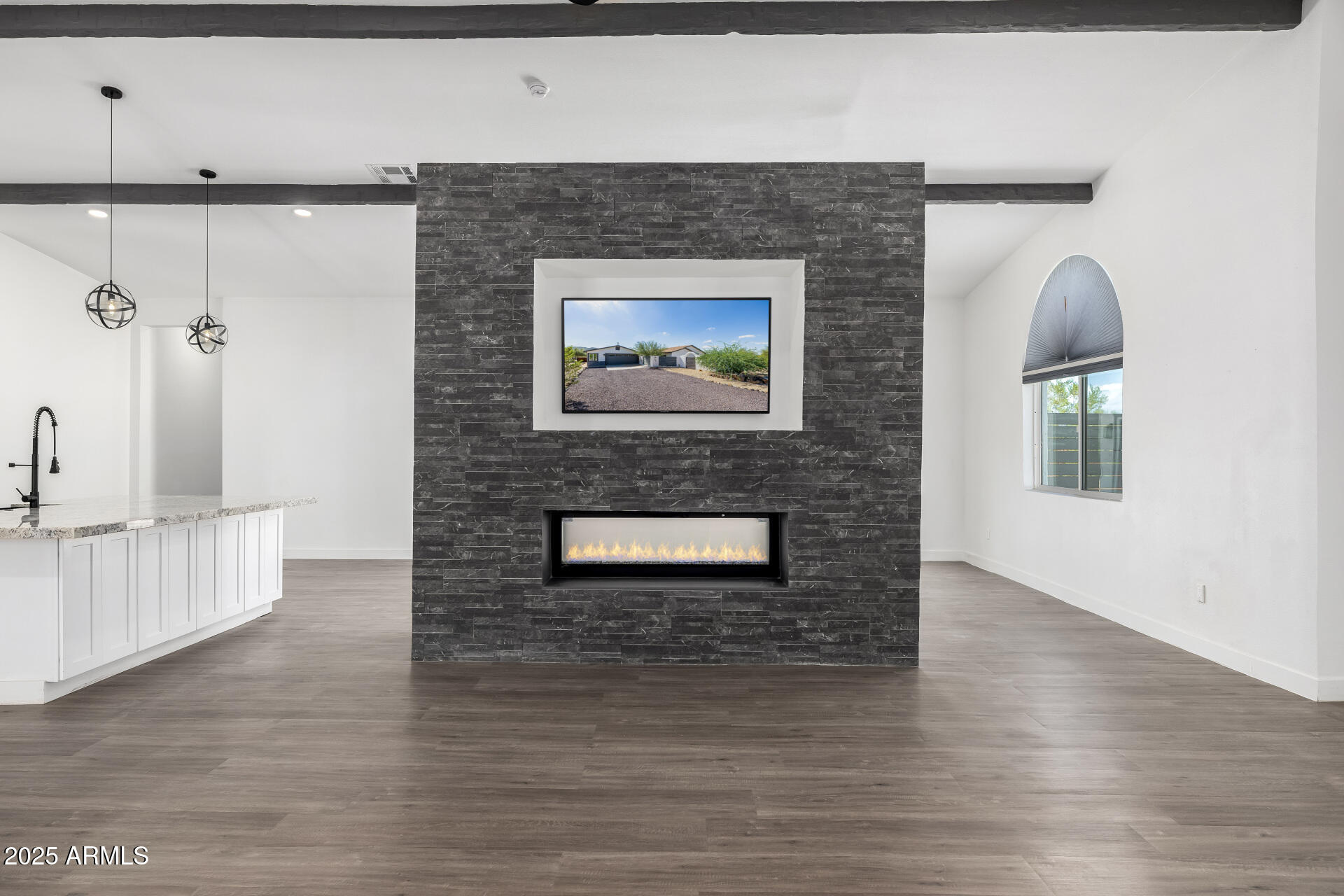 1807 West Joy Ranch Road Phoenix, AZ 85086 - Photo 8 of 49 a room with a wooden floor and a rug