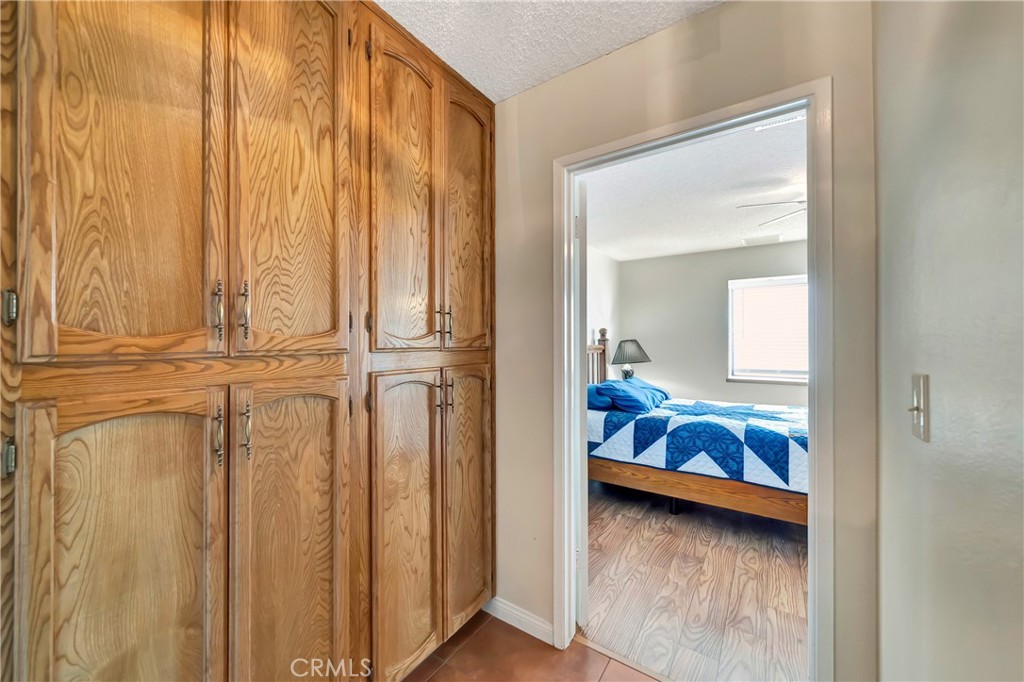 729 North Sunland Drive Ridgecrest, CA 93555 - Photo 23 of 52 a bedroom with a bed and a mirror