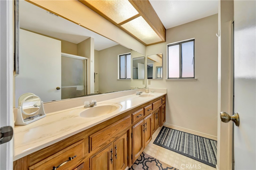 729 North Sunland Drive Ridgecrest, CA 93555 - Photo 27 of 52 a bathroom with a sink and a mirror