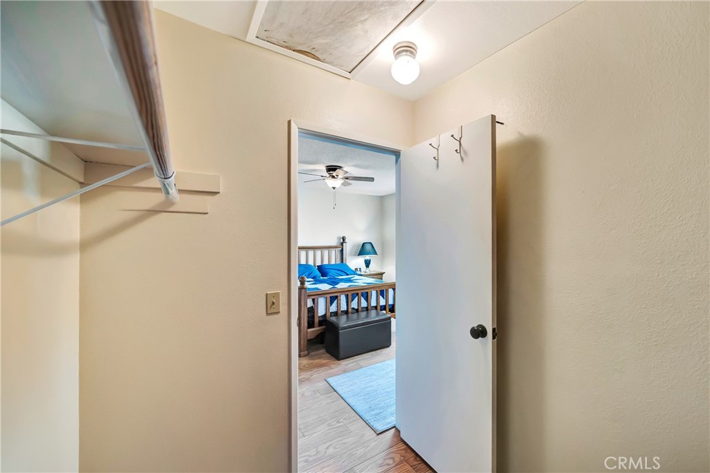 729 North Sunland Drive Ridgecrest, CA 93555 - Photo 30 of 52 a hallway with sliding door and a hallway