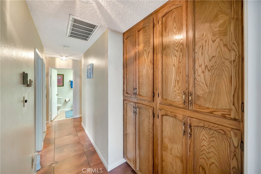 729 North Sunland Drive Ridgecrest, CA 93555 - Photo 31 of 52 a view of a hallway with wooden floor