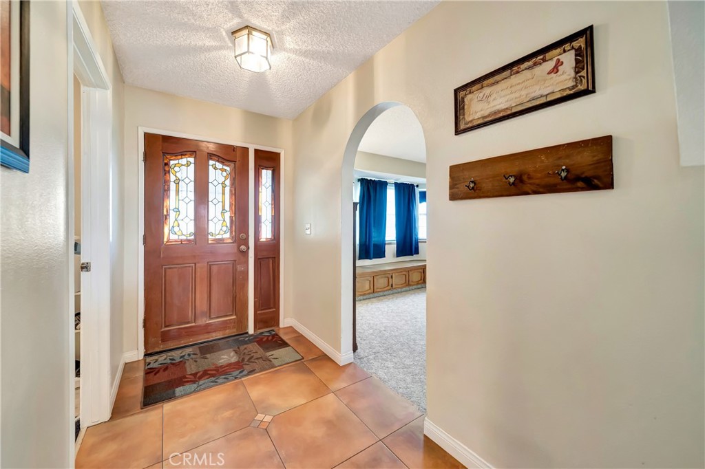 729 North Sunland Drive Ridgecrest, CA 93555 - Photo 4 of 52 a view of a hallway with front door