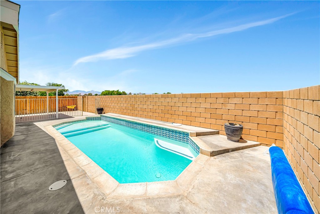 729 North Sunland Drive Ridgecrest, CA 93555 - Photo 44 of 52 a view of a swimming pool and an outdoor seating