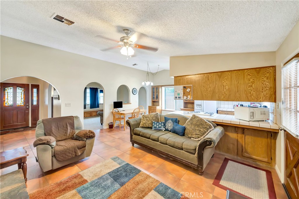 729 North Sunland Drive Ridgecrest, CA 93555 - Photo 10 of 52 a living room with furniture and a large window