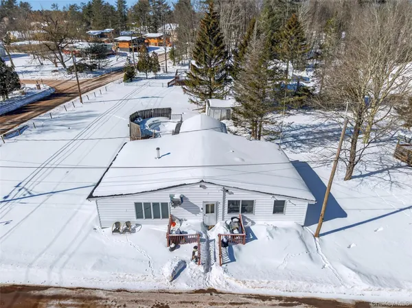 a view of a patio with dining table and chairs