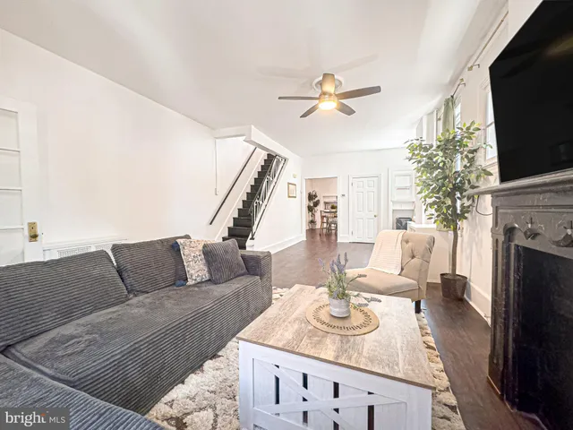 a living room with furniture fireplace and flat screen tv