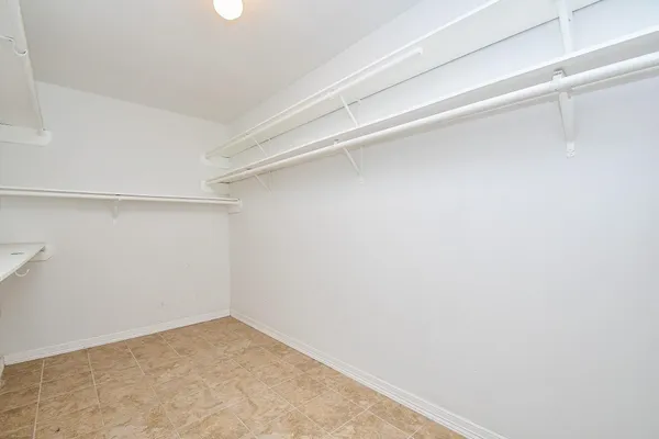 a view of a room with shelf on the wall