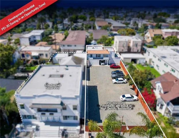 an aerial view of a house with a swimming pool