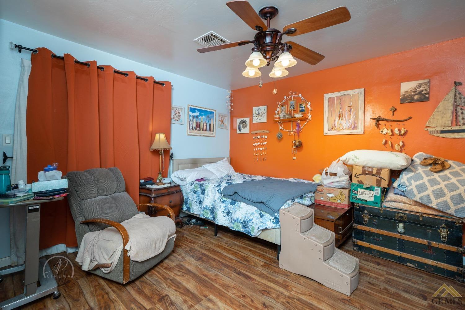 Undisclosed Address Taft, CA 93268 - Photo 11 of 21 a bedroom with furniture and a chandelier fan