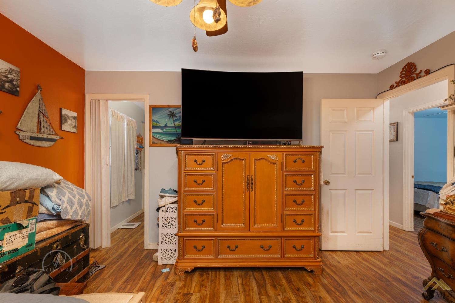 Undisclosed Address Taft, CA 93268 - Photo 12 of 21 a living room with furniture and a flat screen tv